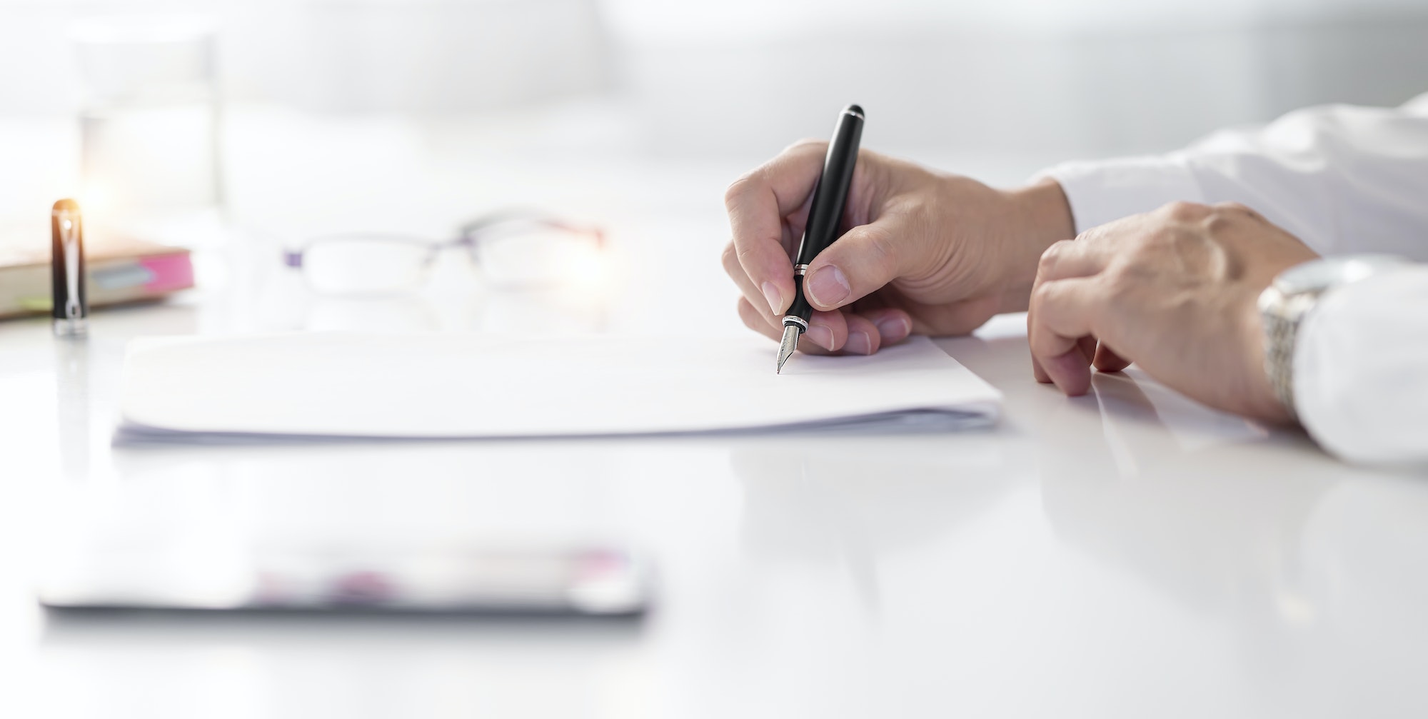 Business signing contact. Executive businessman signing a contract in office.