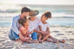 Parents, kids and beach sand vacation, family holiday and summer sea travel together in Portugal. S