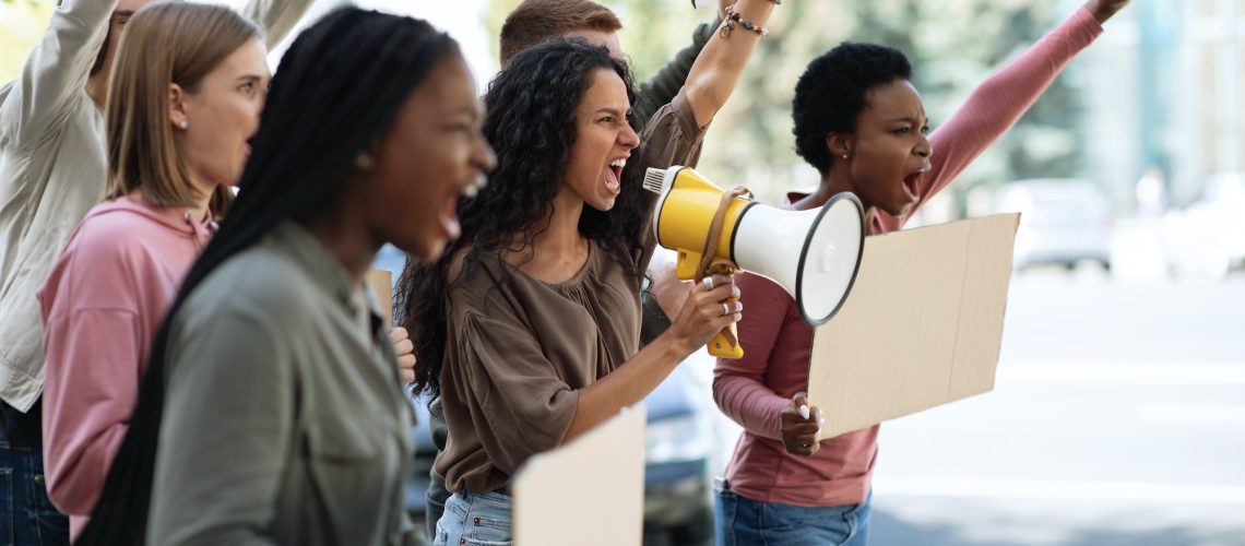 Active young people making strike on the street