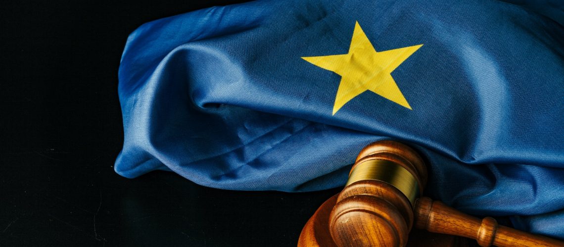 Gavel and european union flag on black background